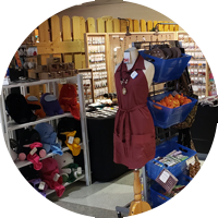 Craft show display showing apron and plushies